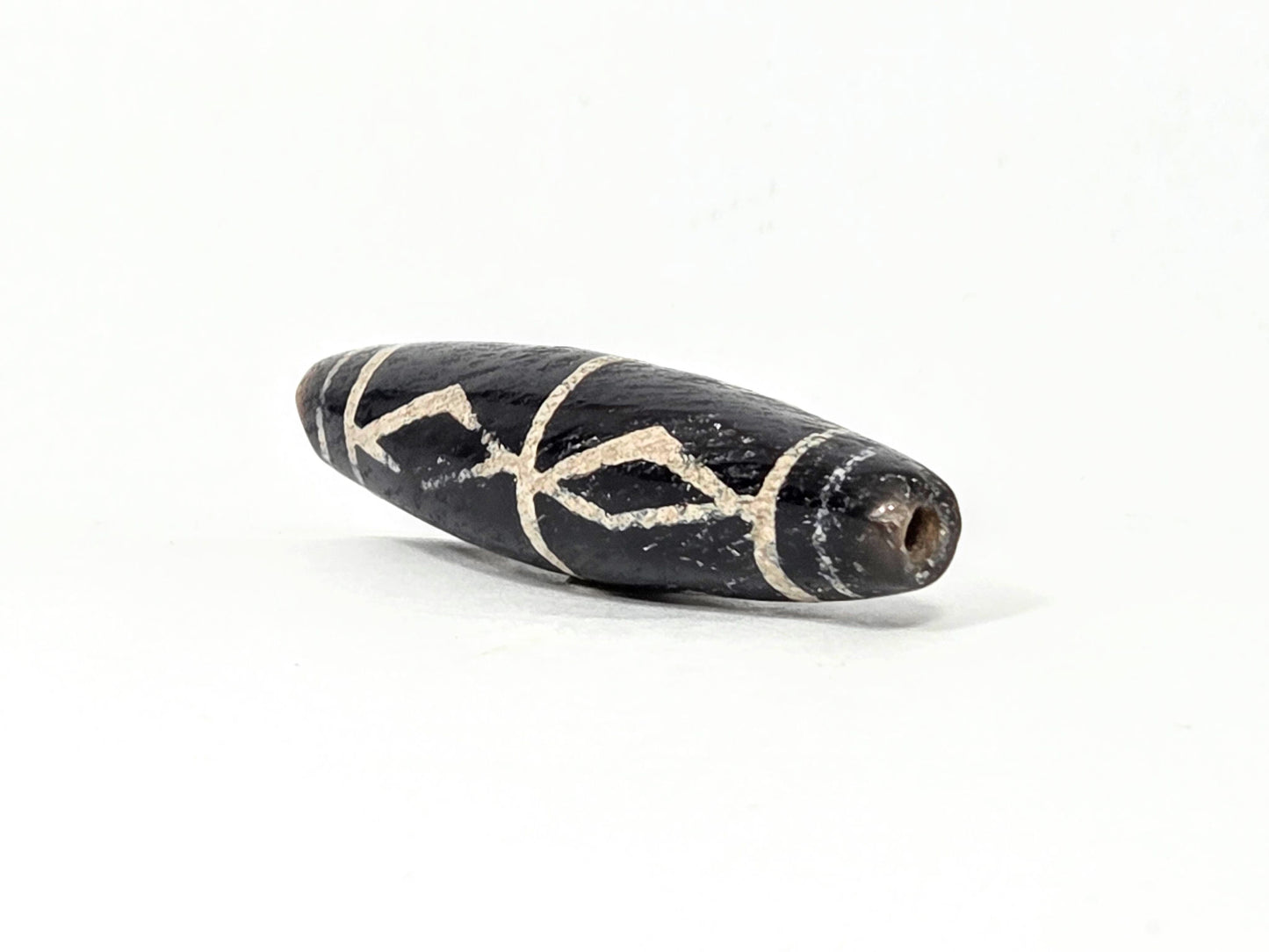 Ac-062426-3DS ancient three diamond spear agate dzi 49.1x12.2mm angled abrupt end small drill hole dark tip unretouched