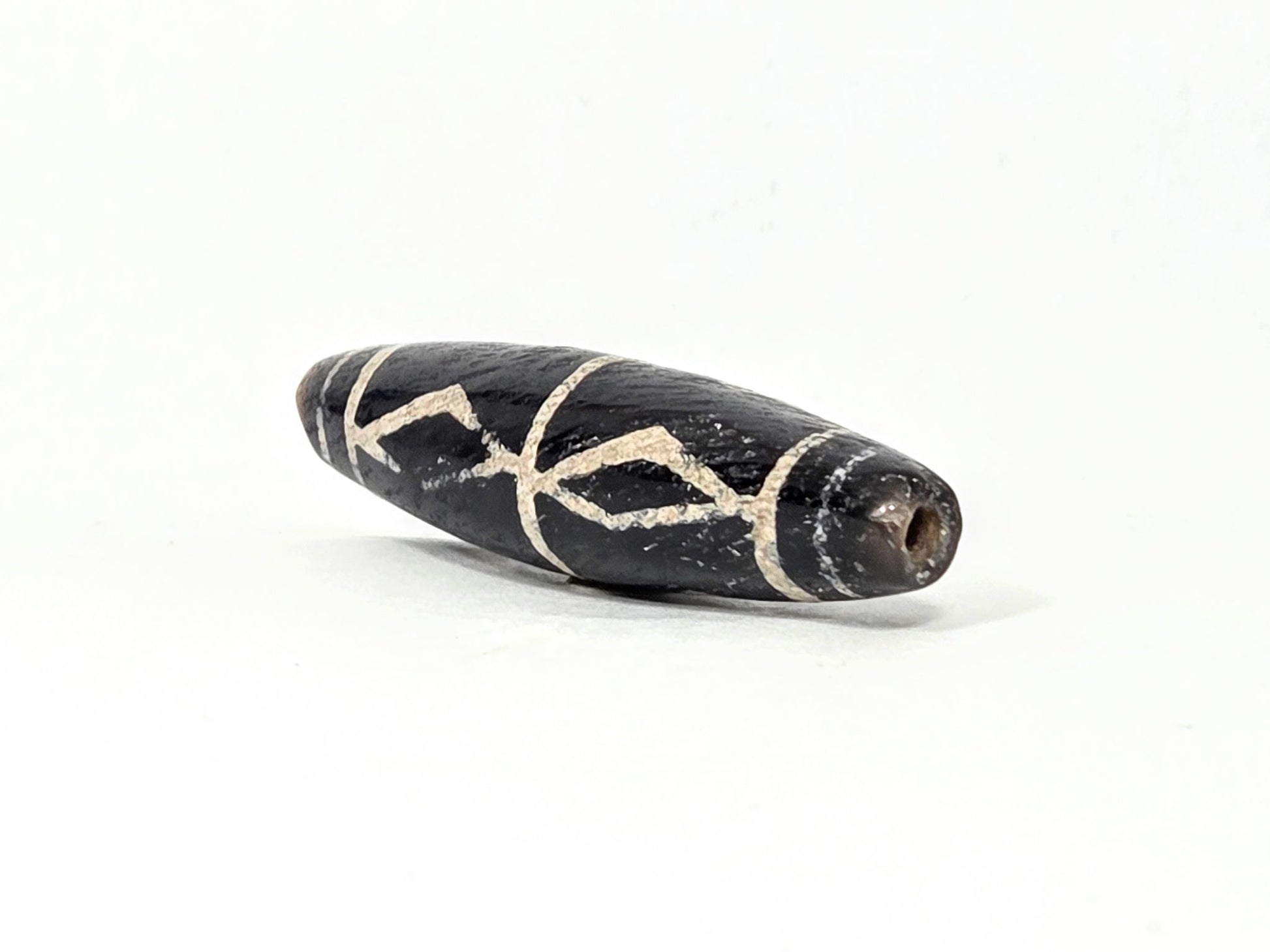 Ac-062426-3DS ancient three diamond spear agate dzi 49.1x12.2mm angled abrupt end small drill hole dark tip unretouched