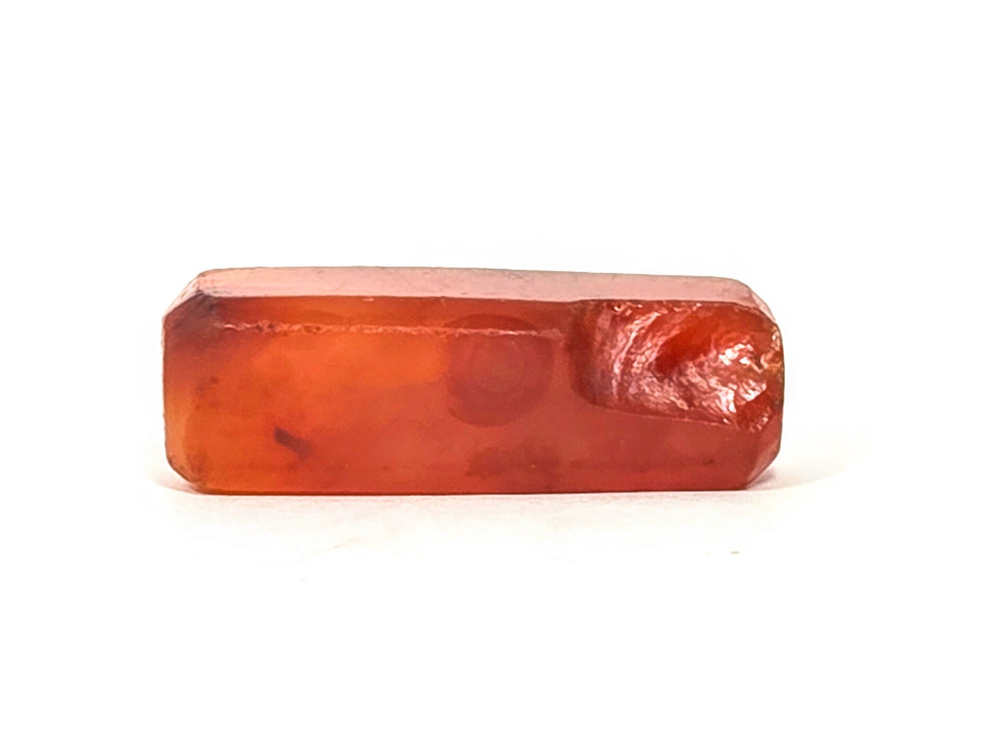 Ac-071026-CBEV2 ancient Indus Valley beveled carnelian 29.2mm face A dark inclusions chipping at right end unretouched