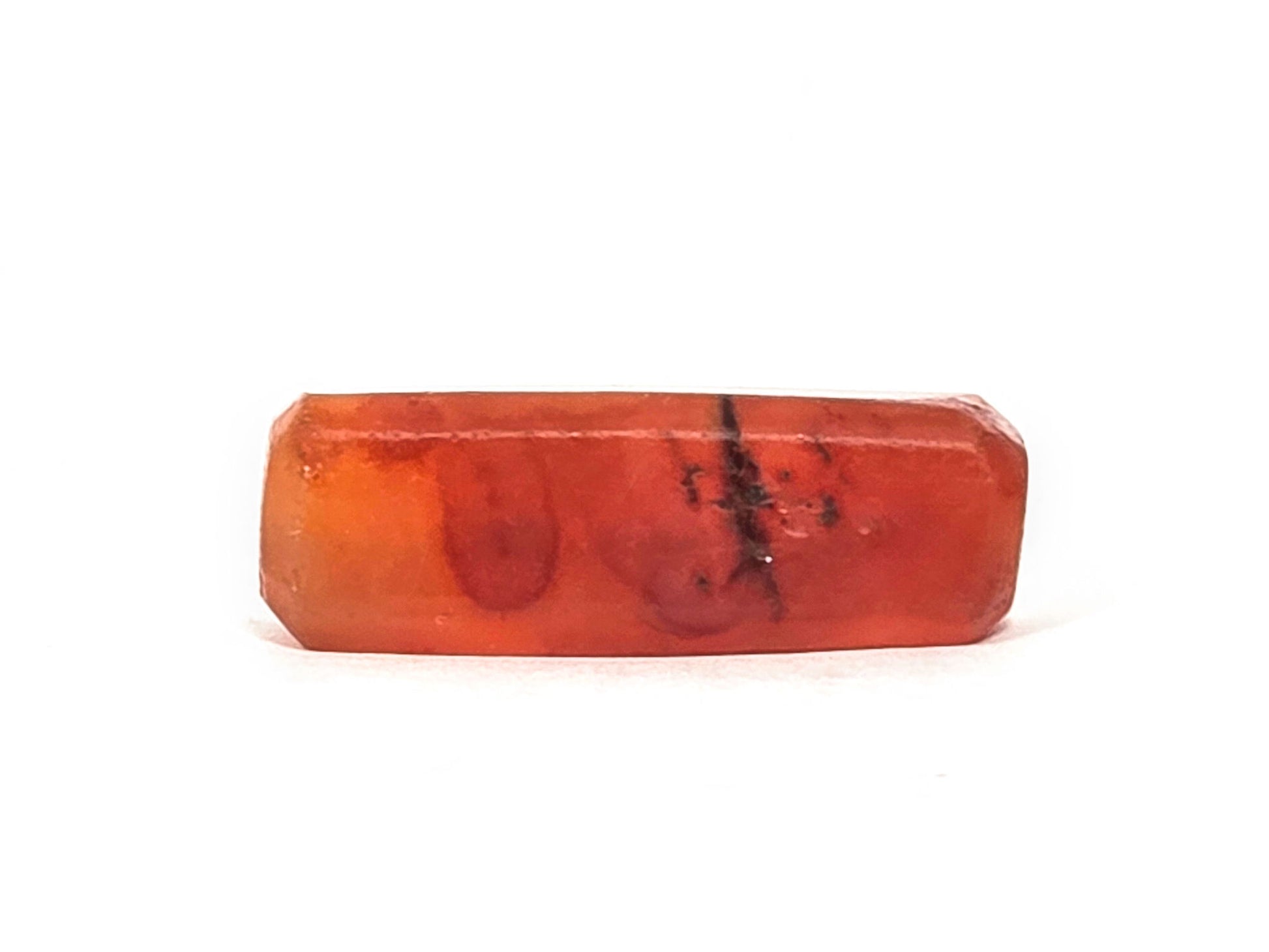 Ac-071026-CBEV2 ancient beveled carnelian orange-red face C large dark inclusion zones body intact unretouched