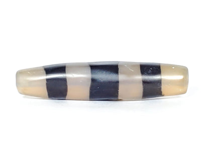 Ac-061426-5SChung ancient Cho dzi, 57.5×13.1mm, Face A, milky translucent grey-white ground, pitch-black bands, unretouched