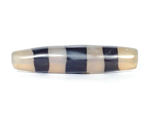 Ac-061426-5SChung ancient Cho dzi, 57.5×13.1mm, Face A, milky translucent grey-white ground, pitch-black bands, unretouched