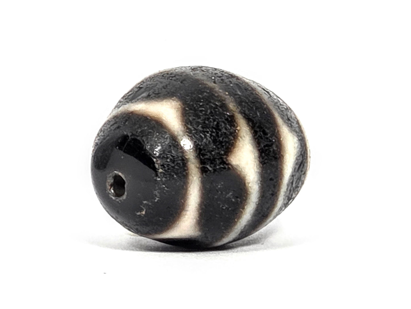 Ac-072326-RDW ancient round double wave dzi drill end B small chip at drill opening disclosed unretouched