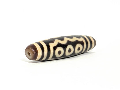 Ac-071026-7E ancient seven eye dzi angled view drill end B four-eye face visible unretouched