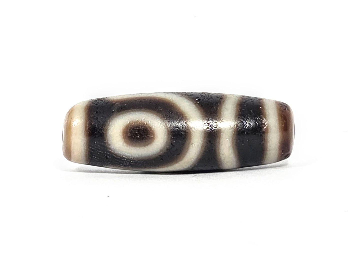 Ac-073026-2E2 ancient two eye dzi pitch-black agate face B clean concentric eye warm tan end cap unretouched