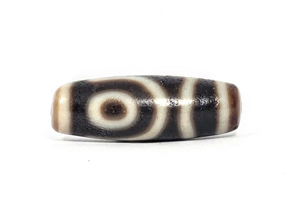 Ac-073026-2E2 ancient two eye dzi pitch-black agate face B clean concentric eye warm tan end cap unretouched