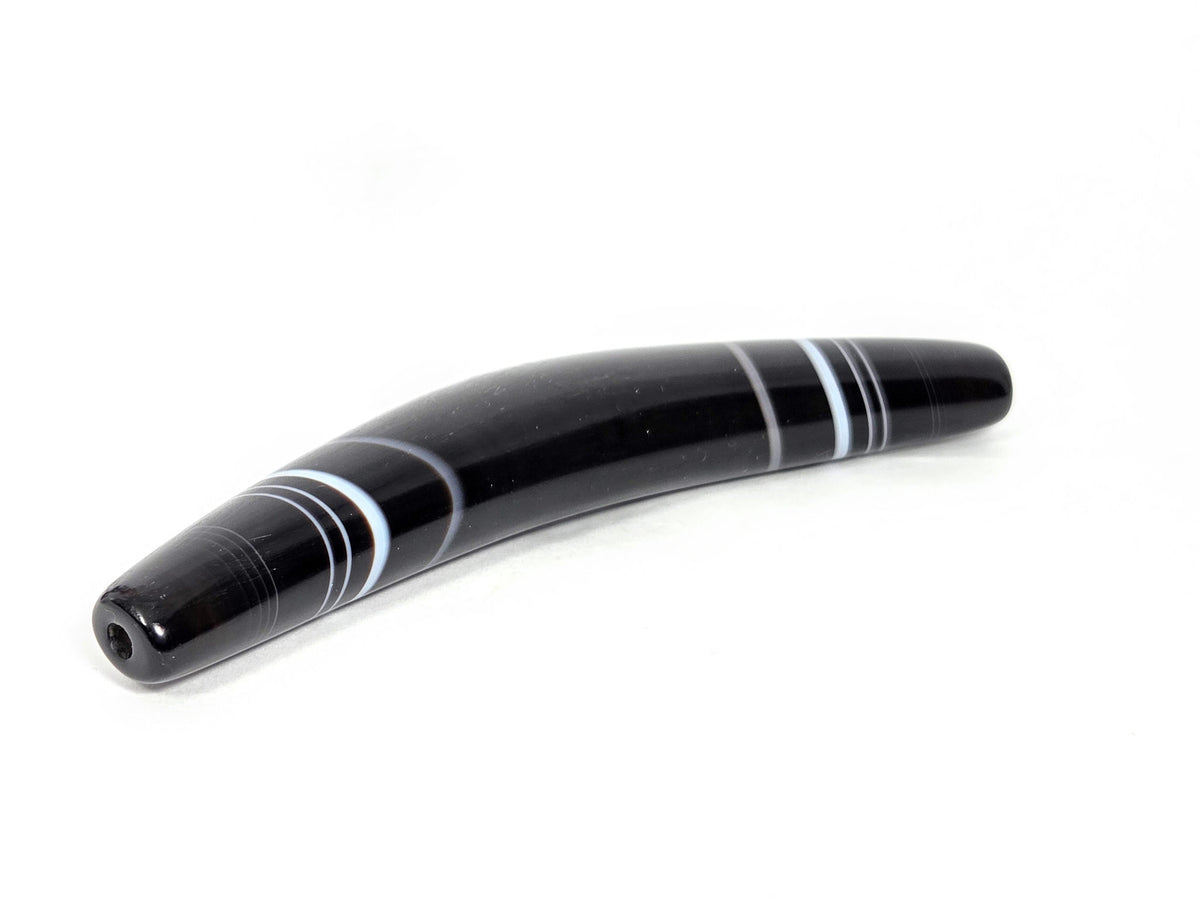 At-N-071126-BOW three-quarter view, narrow tapered drill-hole end, warm agate undertone visible, unretouched