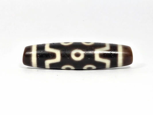 Seven Eye At-072226-7E 50.7×12.7mm pitch-black agate face A — S-curve connectors, eye distribution, unretouched.