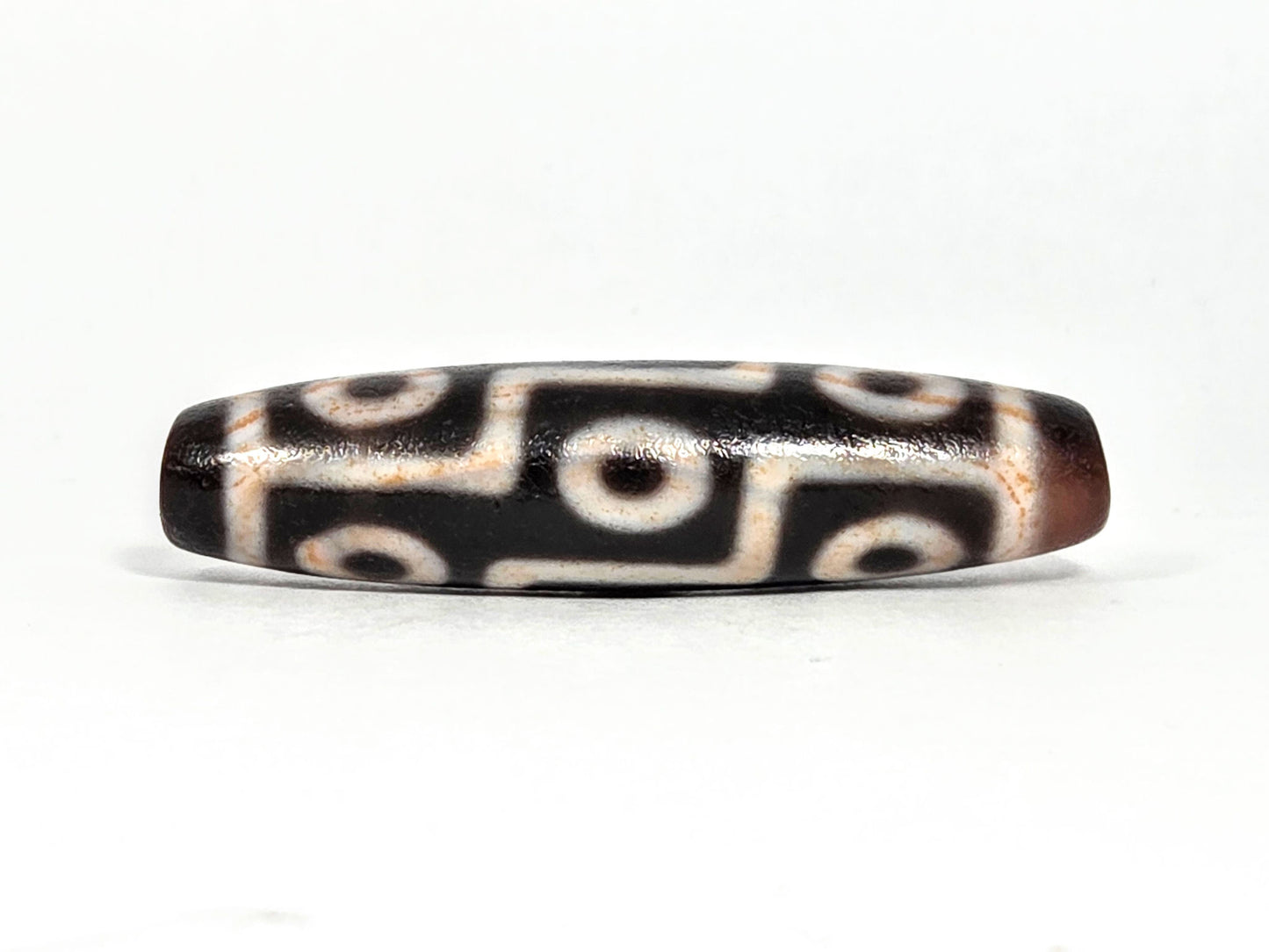 Nine Eye bloodspot At-071426-9EBS2 48.8×12.1mm dark agate face A — 3+3 eye grid, cream zones, unretouched.