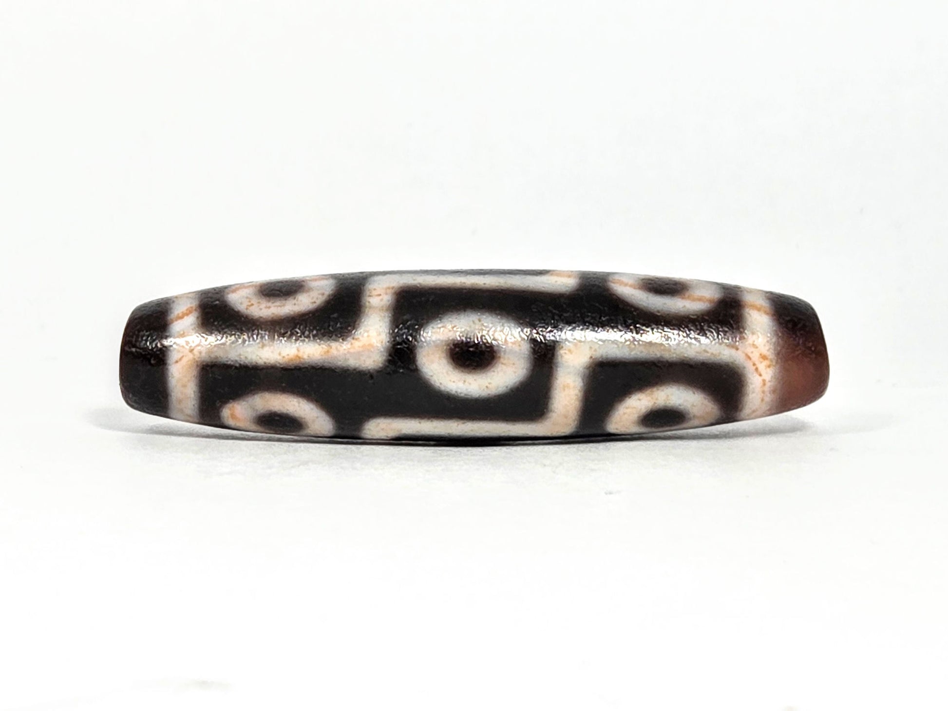 Nine Eye bloodspot At-071426-9EBS2 48.8×12.1mm dark agate face A — 3+3 eye grid, cream zones, unretouched.