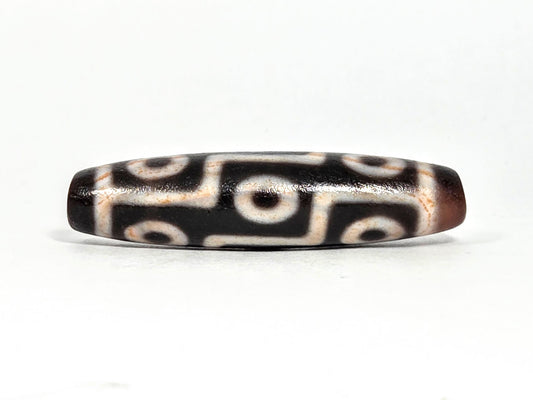 Nine Eye bloodspot At-071426-9EBS2 48.8×12.1mm dark agate face A — 3+3 eye grid, cream zones, unretouched.