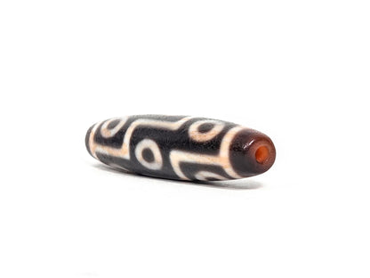 At-071426-9EBS2 end angle A — warm reddish-brown end cap, clean drill opening, motif wrap visible, unretouched.