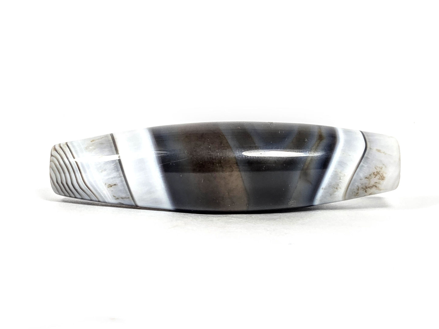 At-N-071426-NBA natural banded agate face B — bold white flanking bands, grey micro-lines at boundary, unretouched.