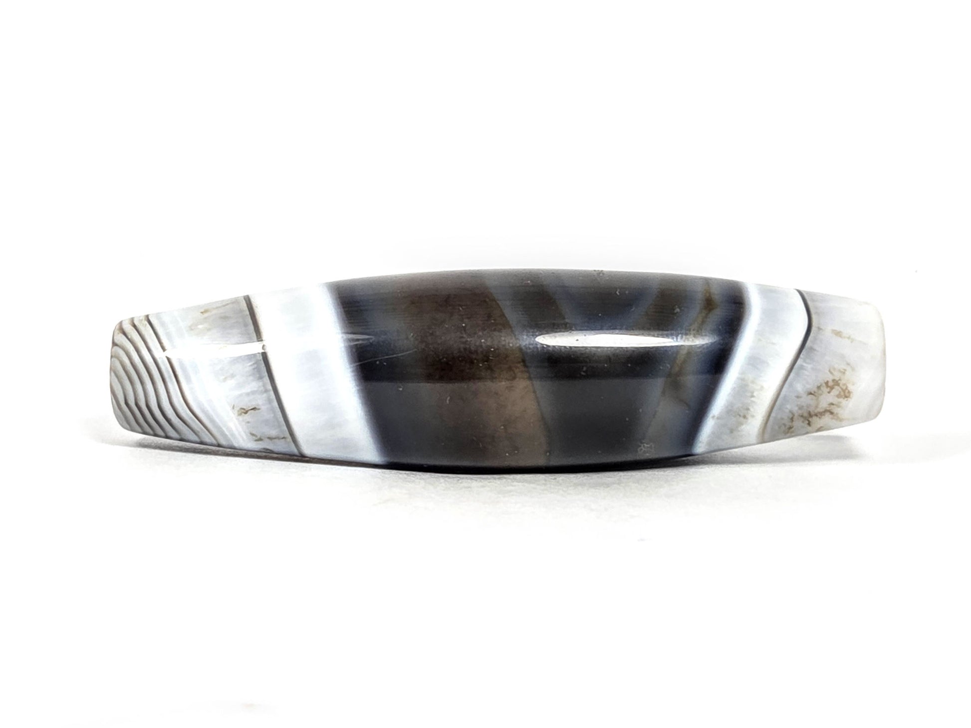 At-N-071426-NBA natural banded agate face B — bold white flanking bands, grey micro-lines at boundary, unretouched.