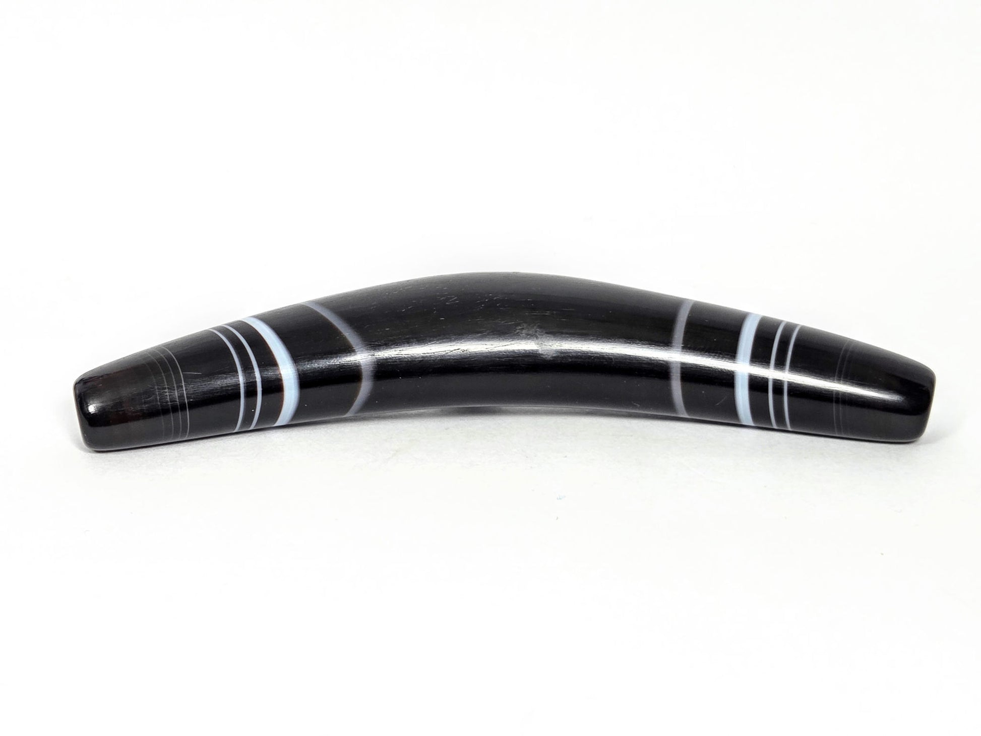 At-N-071126-BOW concave inner curve face, pitch-black bow-shaped natural dzi, banding wraps full circumference, unretouched