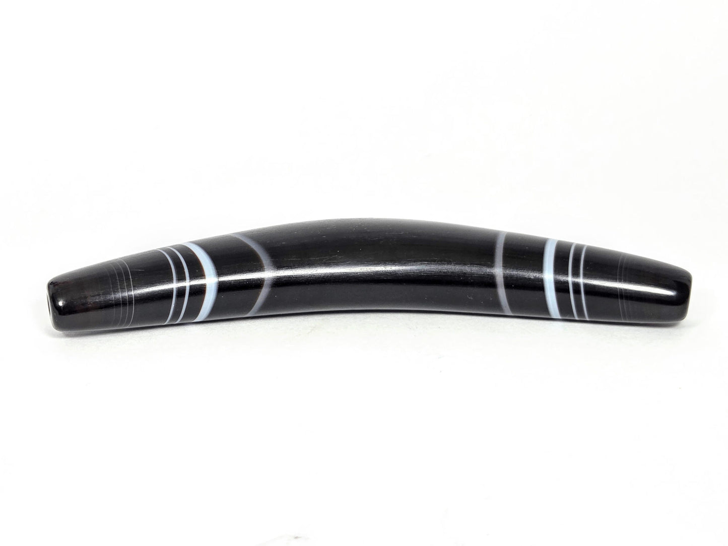 At-N-071126-BOW elevated front view, pitch-black ground confirmed, pale grey-white and blue-grey bands, unretouched