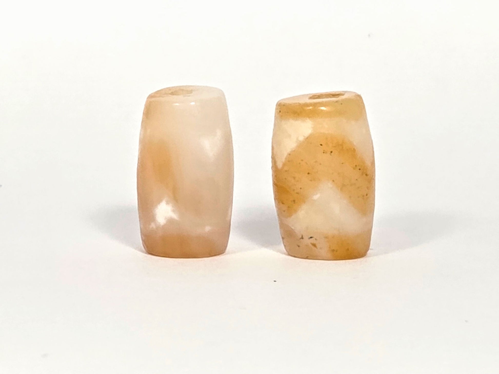 At-073026-WPair antique wave dzi pair face view pale peach-cream left honey ochre right unretouched