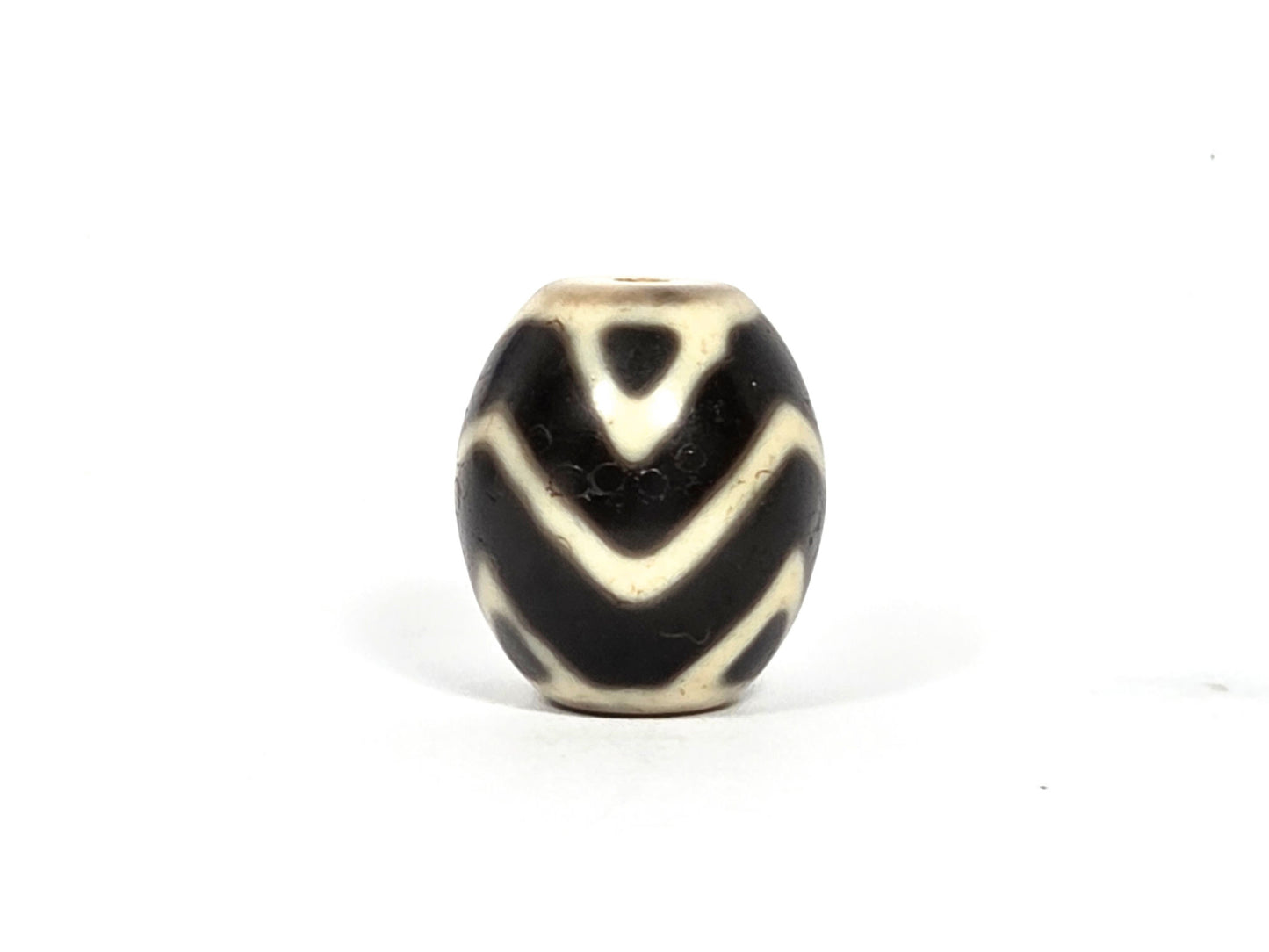 At-080926-WTT antique round Wave Tiger Tooth dzi bead 17.8×15.6mm, top rotation B showing chevron composition with slight wave curve character, unretouched
