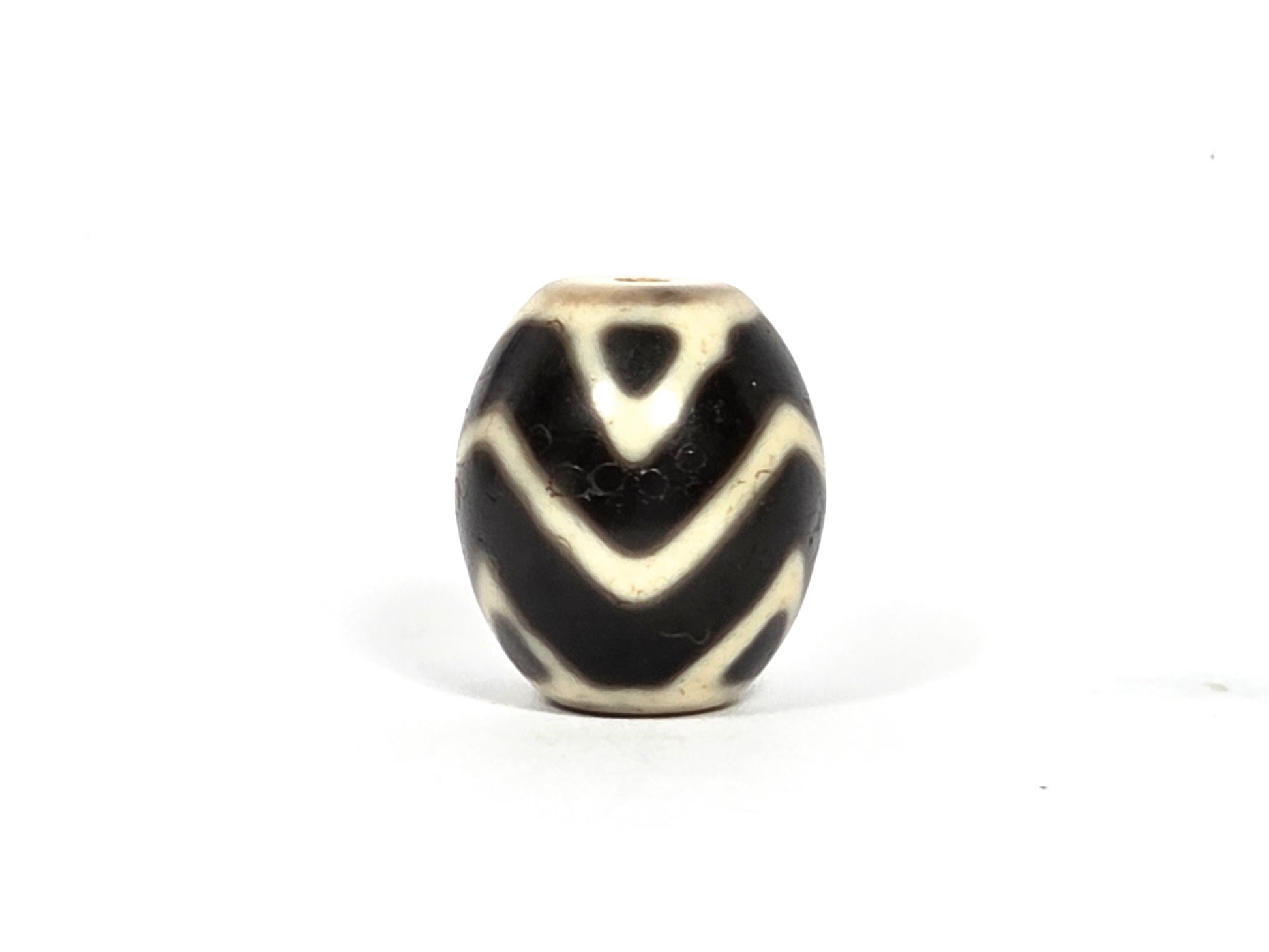 At-080926-WTT antique round Wave Tiger Tooth dzi bead 17.8×15.6mm, top rotation B showing chevron composition with slight wave curve character, unretouched