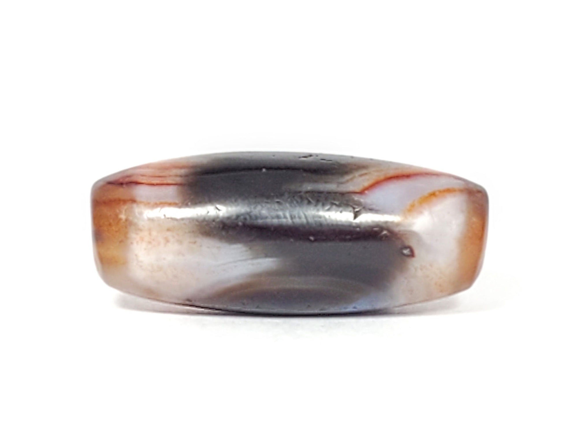 Side view of antique Tasso dzi bead showing black center zone and warm reddish-brown banding, At-052526-TaBS
