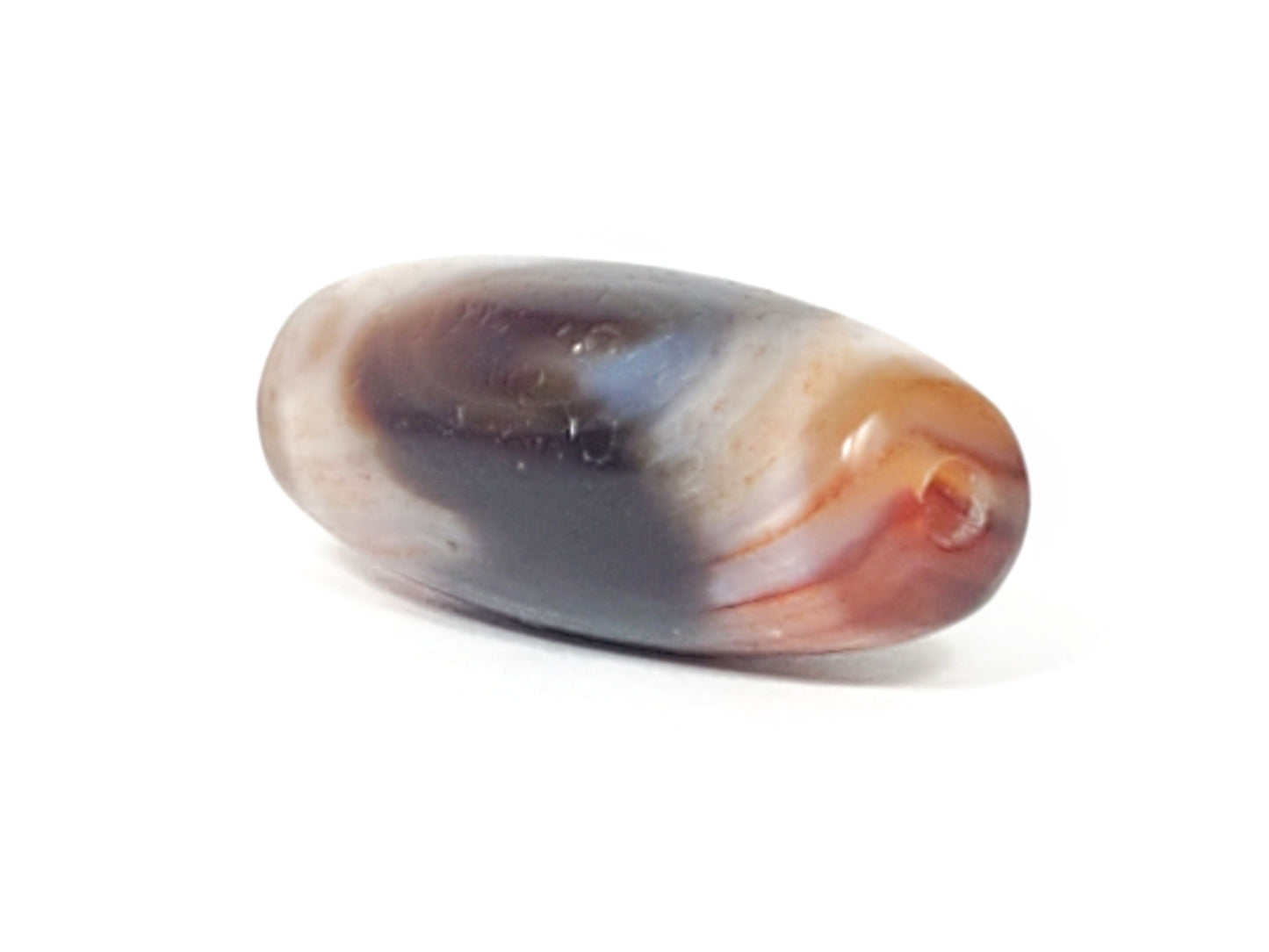 Opposite end of antique Tasso dzi bead with orange bloodspot visible near drill hole, At-052526-TaBS