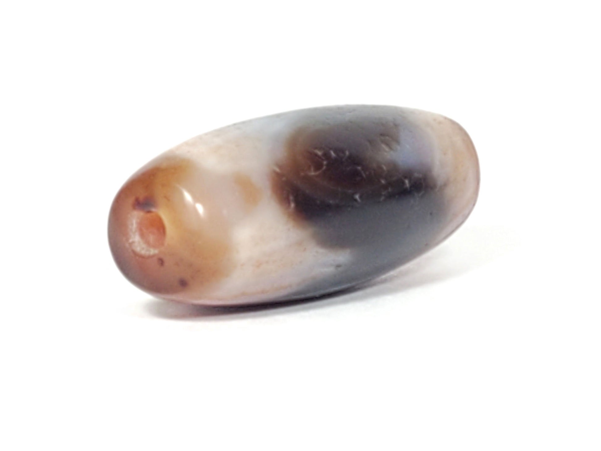End view of antique Tasso dzi bead showing drill hole, grey-black and reddish-brown natural agate, At-052526-TaBS
