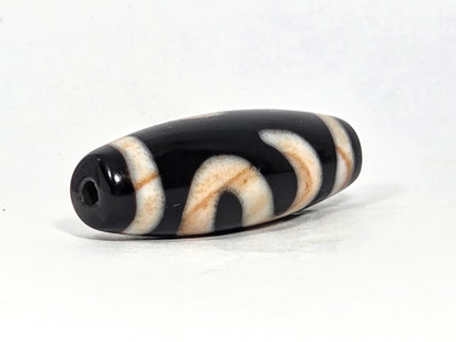 At-070726-MHBS antique money hook dzi bead opposite drill end angled view pitch-black agate fusiform profile unretouched