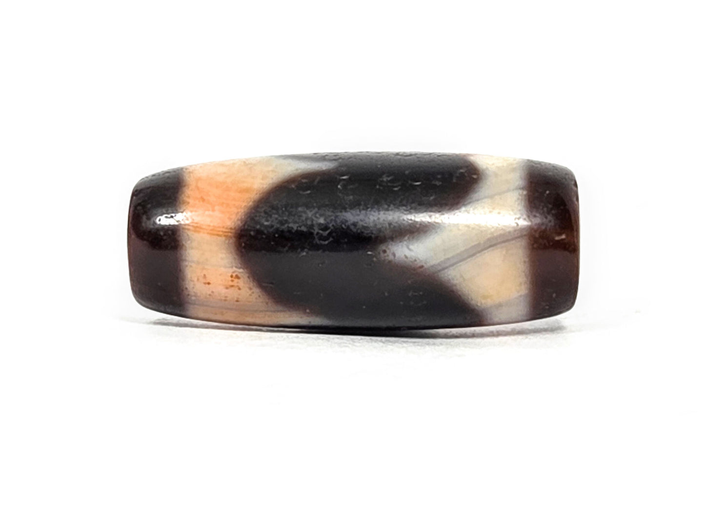 At-071426-TaBS4 Tasso bloodspot face C — motif from third angle, cinnabar-warmed cream zones visible, unretouched.