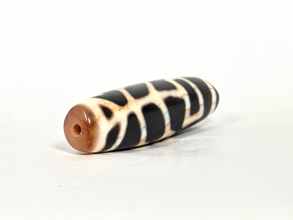 At-070726-TOLBS antique Tree of Life dzi drill-end view warm reddish-brown agate end cap pitch-black body unretouched