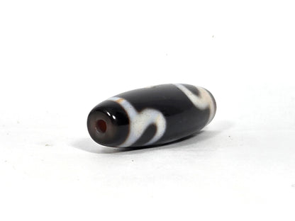 At-090526-RYBS antique ruyi dzi black agate angled opposite drill end warm reddish-brown cap, unretouched
