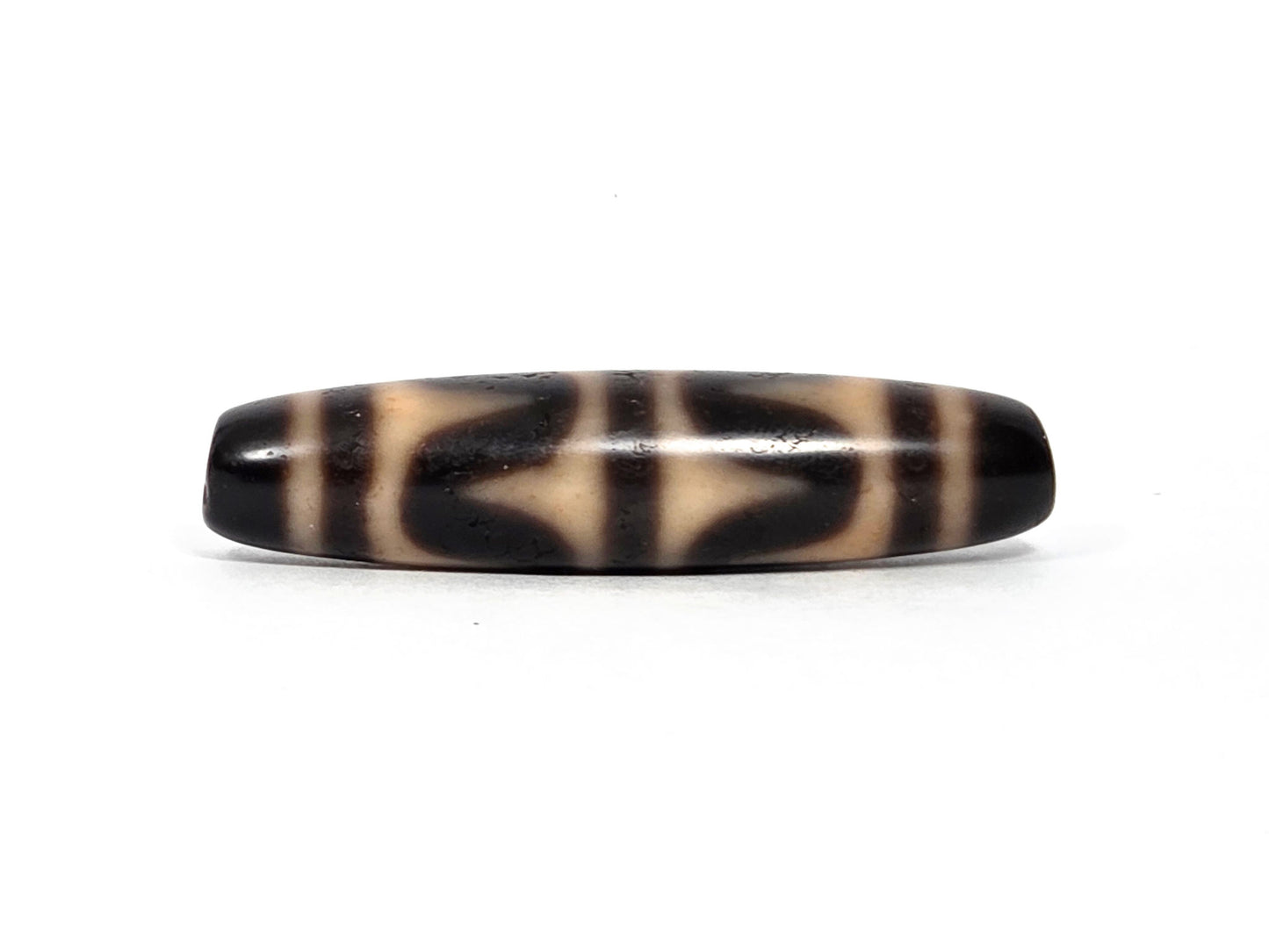 At-090226-DW6 antique double wave dzi dark agate, third rotation narrow profile cream zones, unretouched