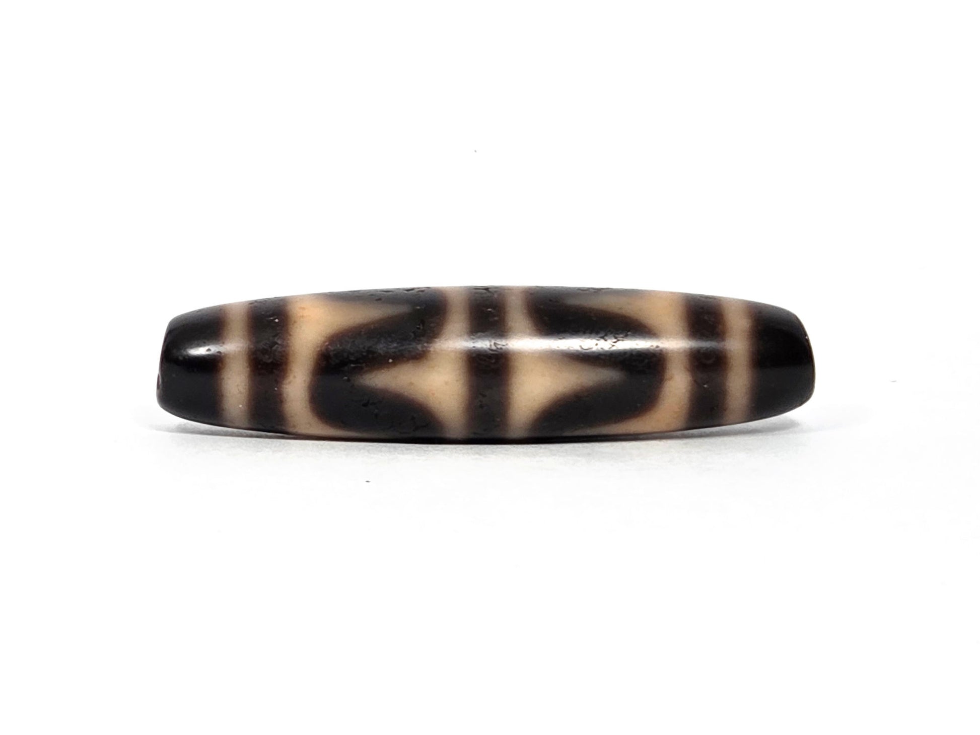 At-090226-DW6 antique double wave dzi dark agate, third rotation narrow profile cream zones, unretouched