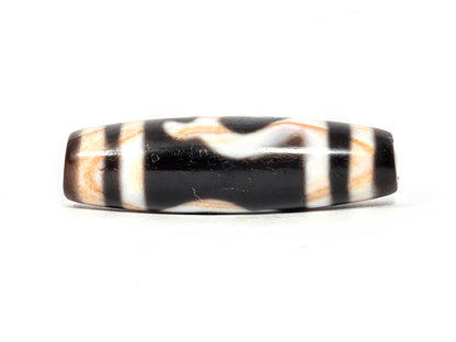 Antique Tibetan Green Tara Dzi bead — Side B reverse showing natural wave and stripe pattern on black agate with visible amber striations — unretouched photo — Ancient Dzi Shop