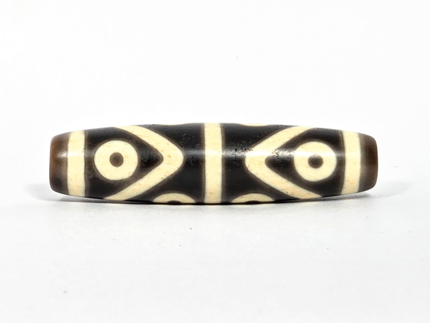 At-073026-8E antique eight eye dzi very dark brown agate face C four eyes 2x2 grid pointed connectors unretouched