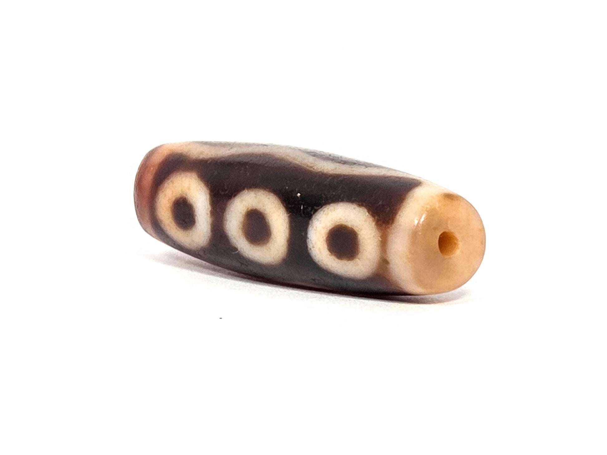 At-072326-5E antique five eye dzi drill end B warm reddish-brown agate-internal colour three eyes unretouched
