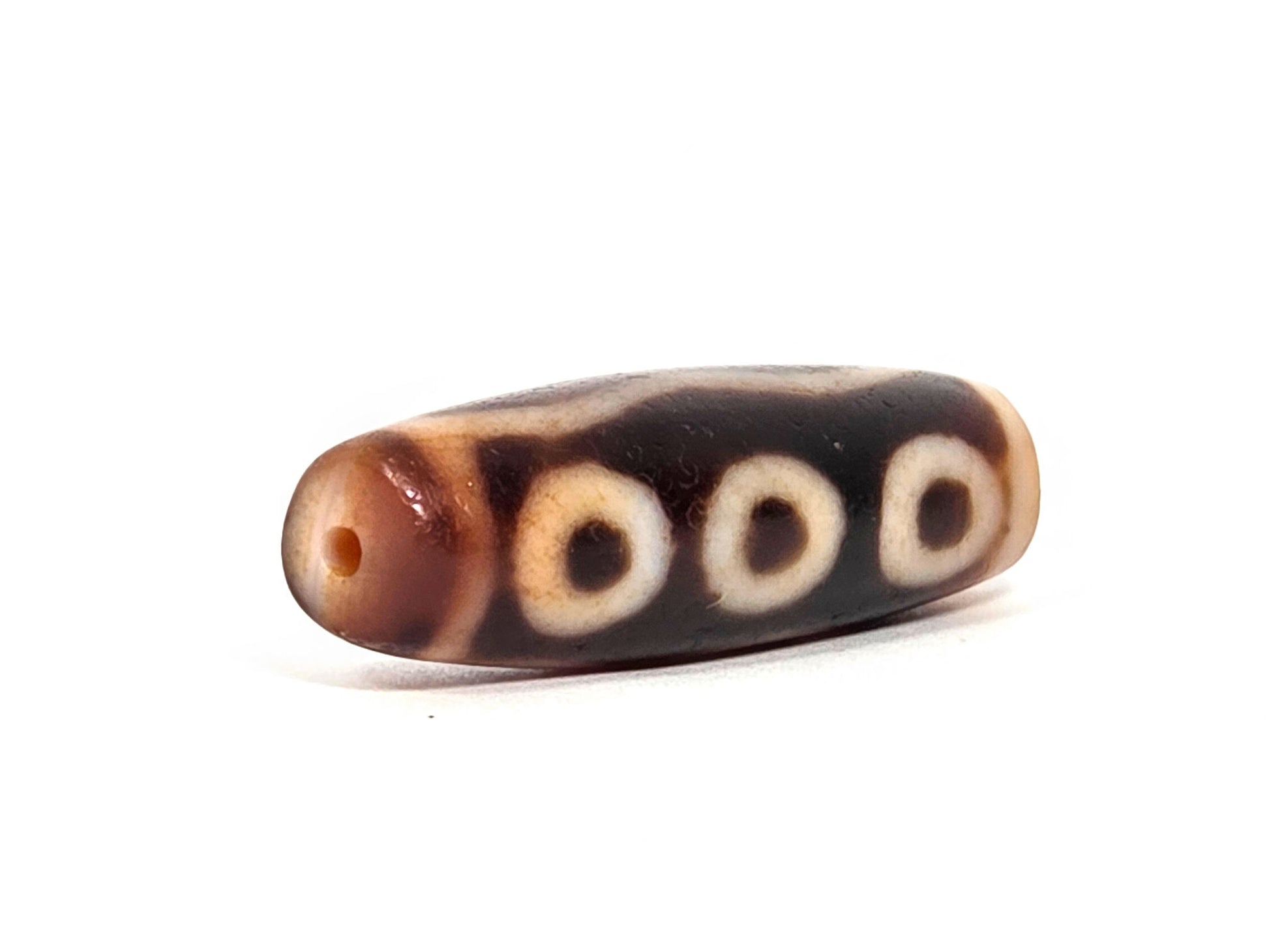 At-072326-5E antique five eye dzi drill end A warm orange-tan agate-internal colour three eyes visible unretouched