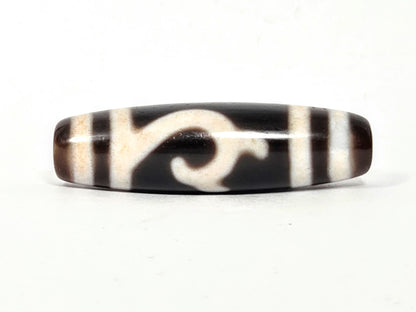 At-043026-GT Face B, cream Green Tara scroll motif, dark chocolate-brown ground, warm brown end cap, unretouched