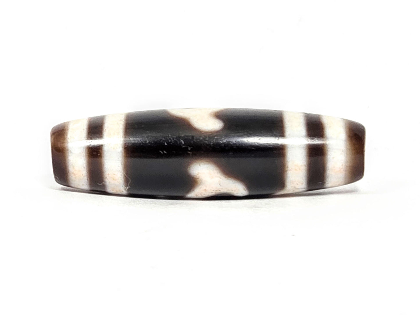 At-043026-GT second connector face, organic cream cloud-form waves on dark chocolate-brown, unretouched