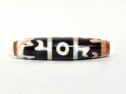 At-070626-GRRP3EBS rotated face 3, Guru Rinpoche three-eye dzi, bright cream-white motif lines, pitch-black ground, unretouched