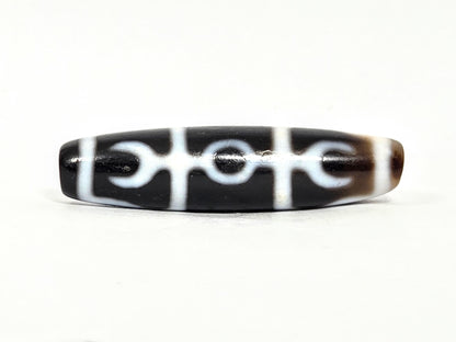 At-071426-GRS Guru Rinpoche Scepter face A low angle — central ring, flanking crescents, white lines, unretouched. 