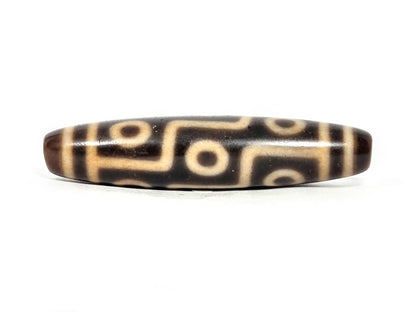 At-071326-9E face C, most pronounced honey-gold warmth in connector lines, warm dark brown agate, nine eye layout, unretouched