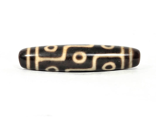 At-070826-9E antique nine eye dzi bead 59.8×13.7mm very dark brown agate front face cream motif unretouched