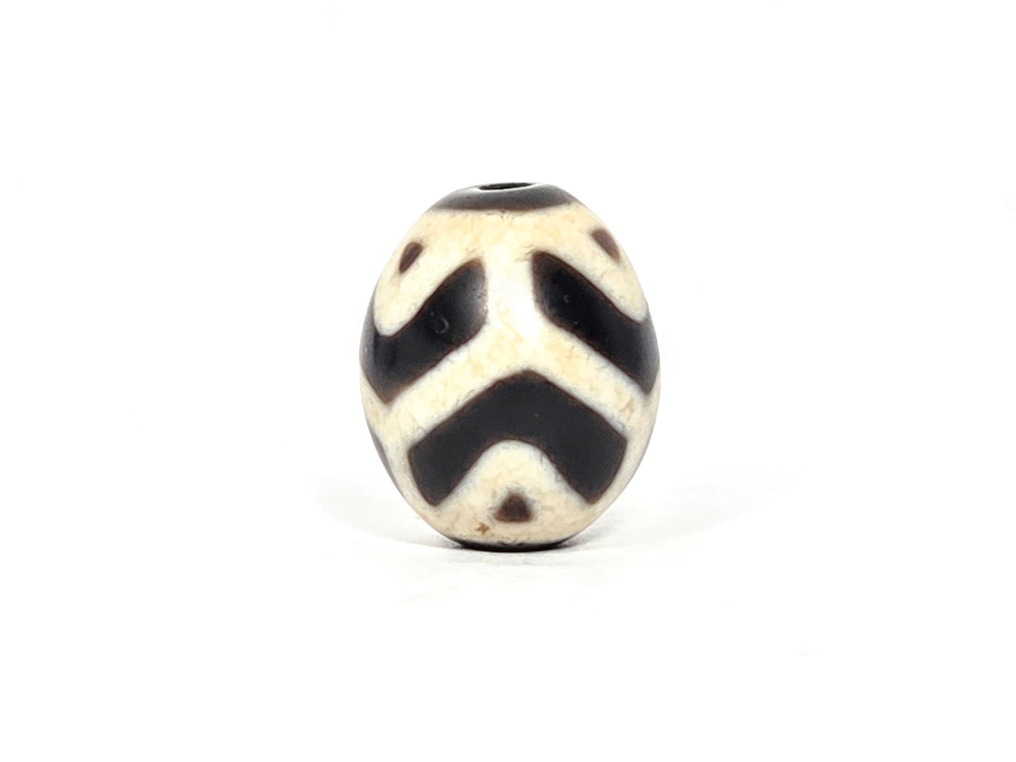 At-070826-RTTL antique round tiger tooth longevity dzi cream-ground agate third face dark chevrons drill top visible unretouched