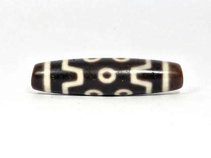 Seven Eye At-072226-7E 50.7×12.7mm pitch-black agate face A — S-curve connectors, eye distribution, unretouched. 