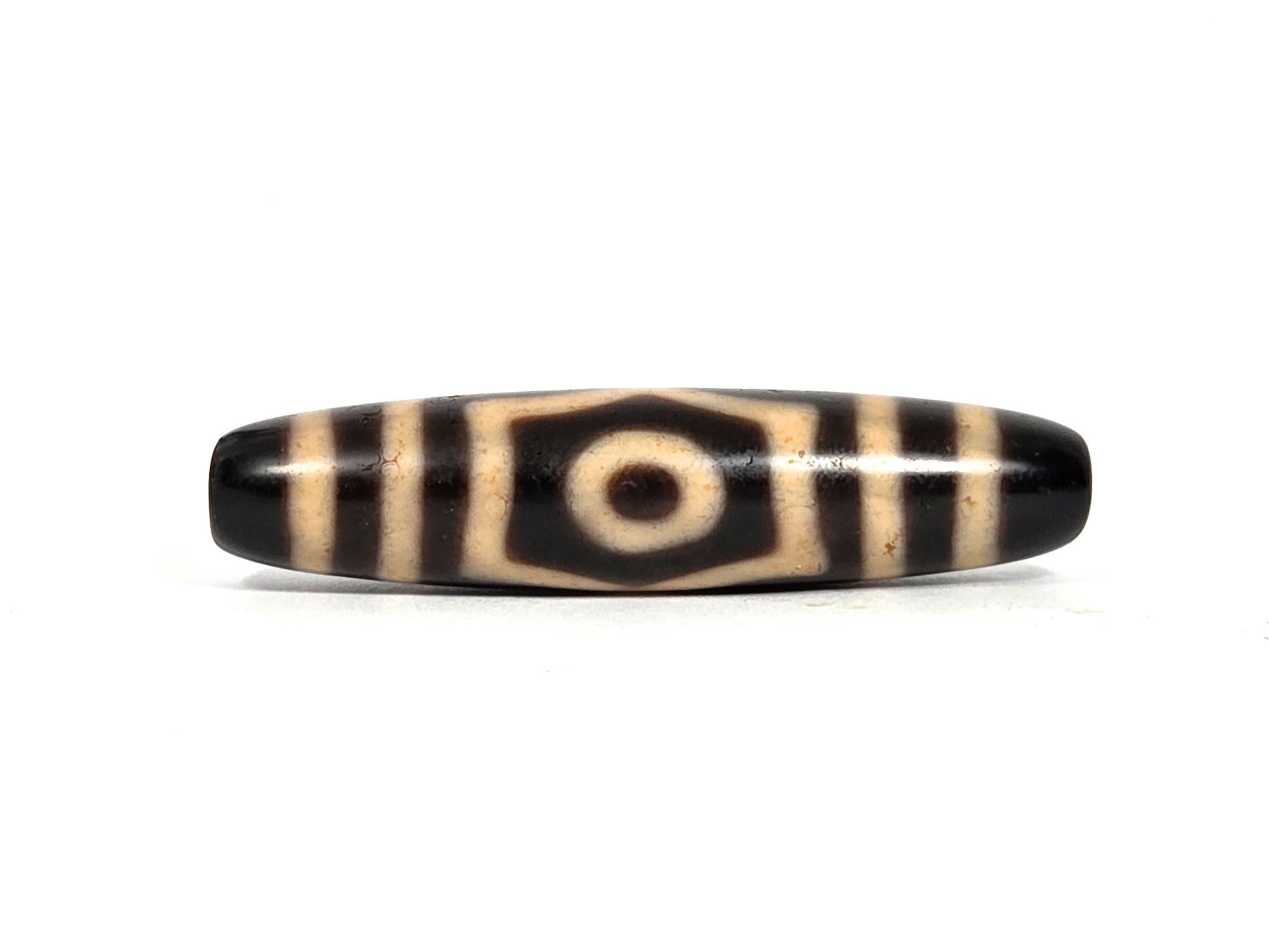At-090626-3E5 antique three eye dzi 50.7×11.8mm black agate face A single eye hexagonal cream surround, unretouched
