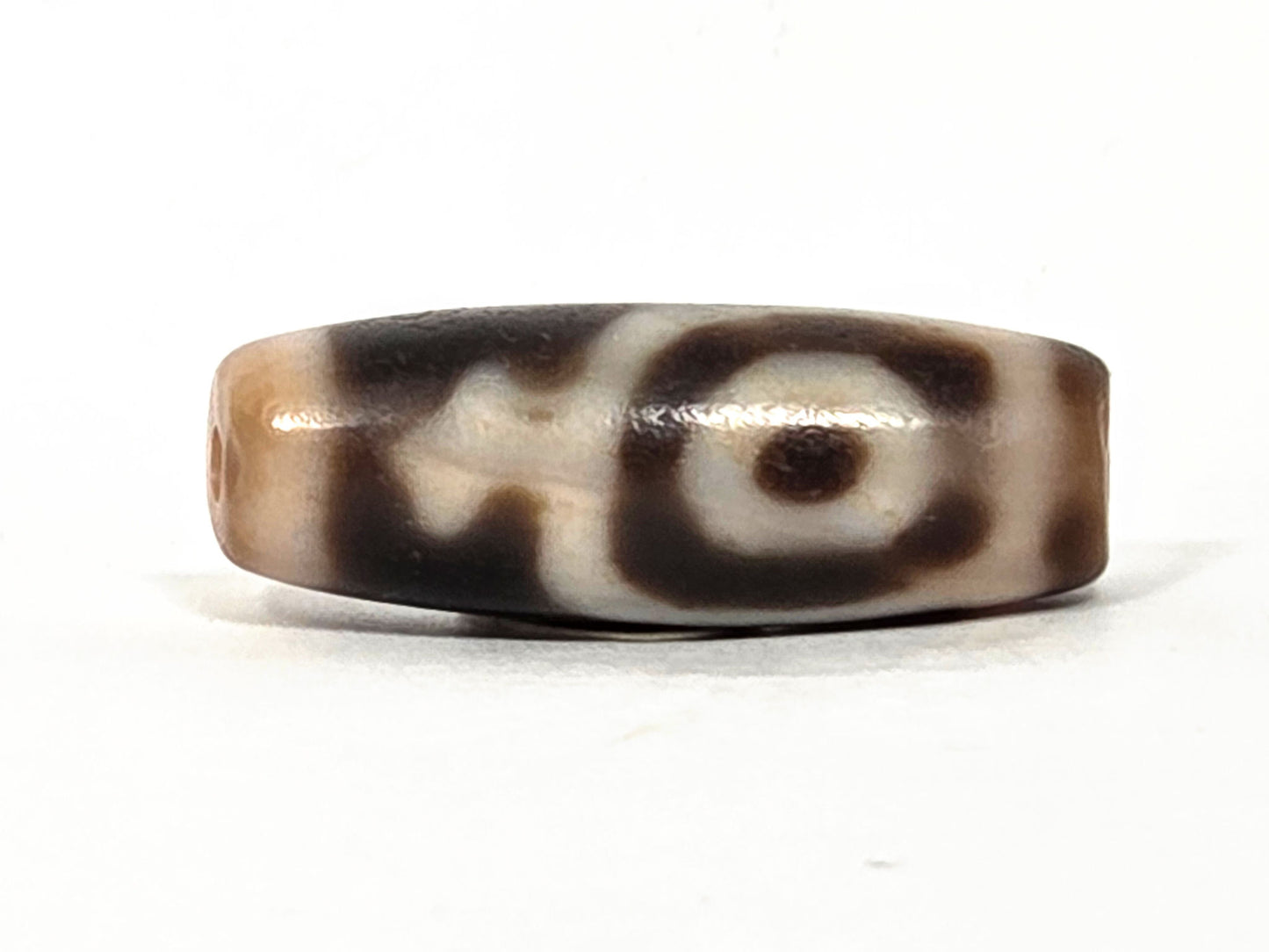 At-062226-2ETV2, face A close view, closed ring eye upper register, treasure vase form, dark brown agate, unretouched