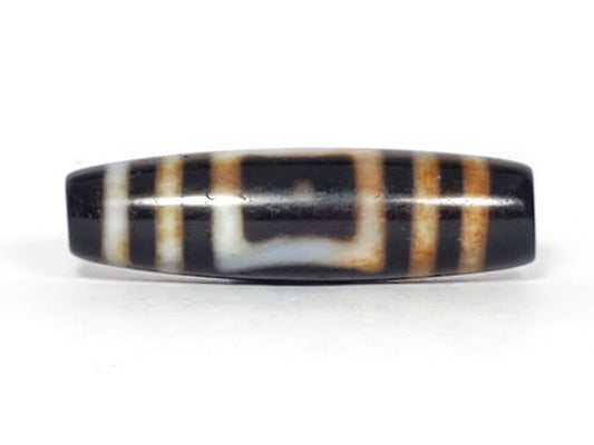 Antique dzi bead Heaven's Gate Earth's Gate motif black white agate bloodspots striped patina elongated barrel shape