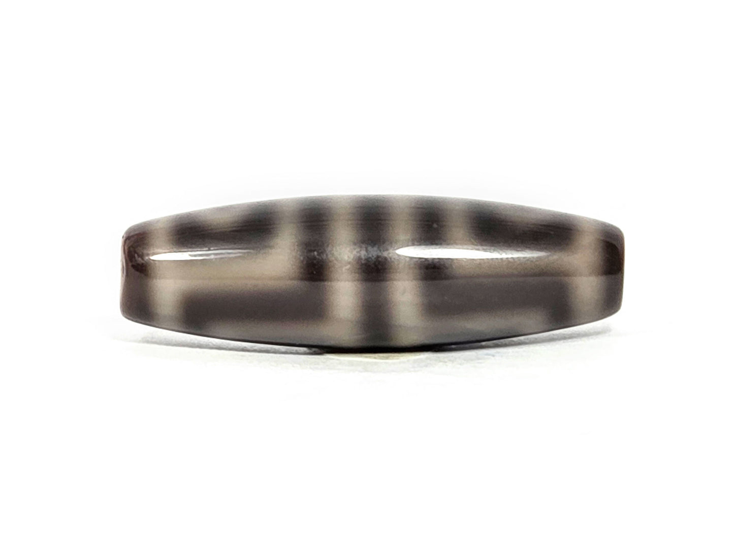 N-071126-4EV face D, fourth side orientation, grey-cream zones diffuse at edges into dark grey-brown ground, unretouched