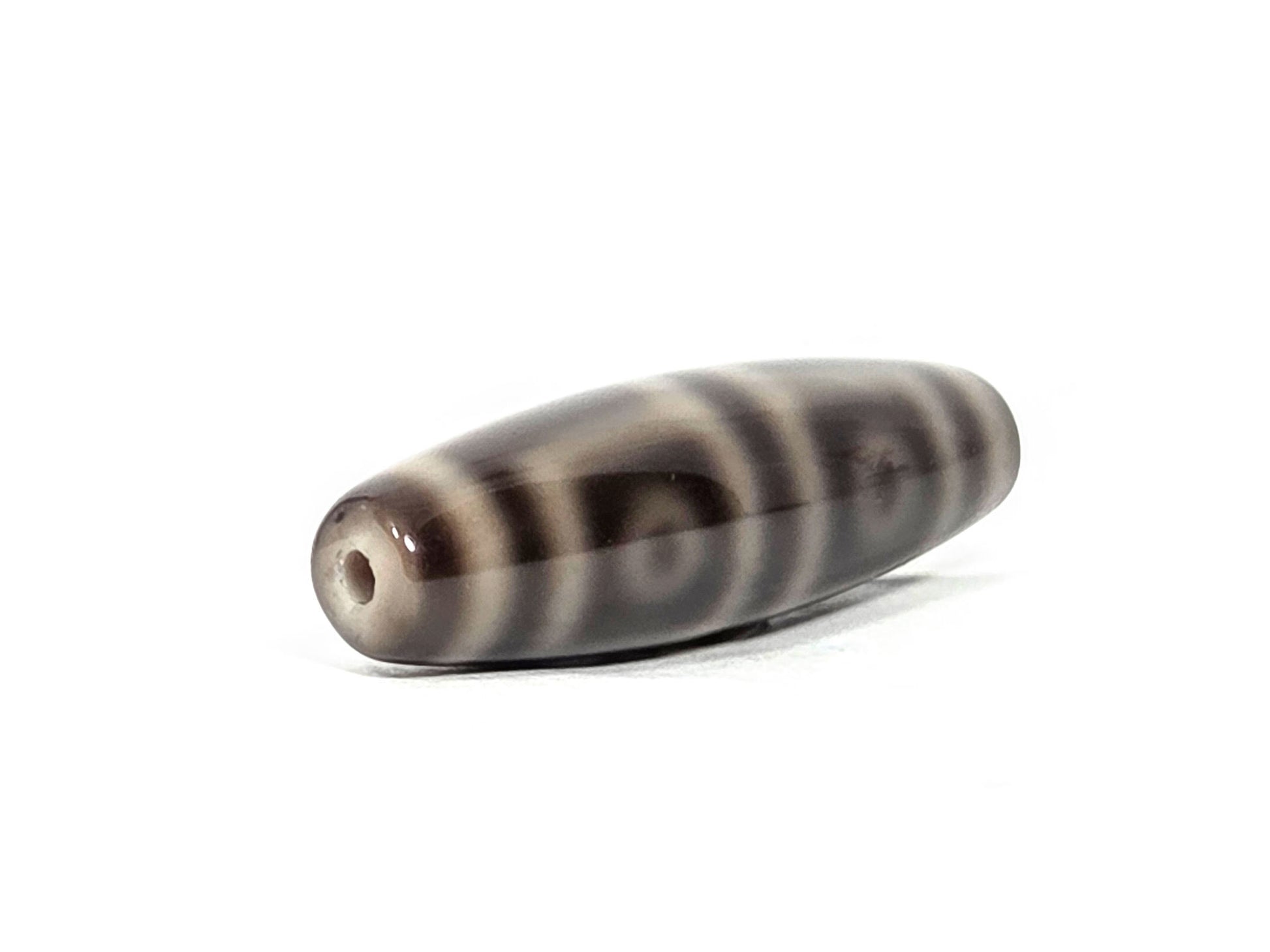 N-071126-4EV end view two, four eye rings visible on face from opposite end, second drill hole, grey-brown agate, unretouched