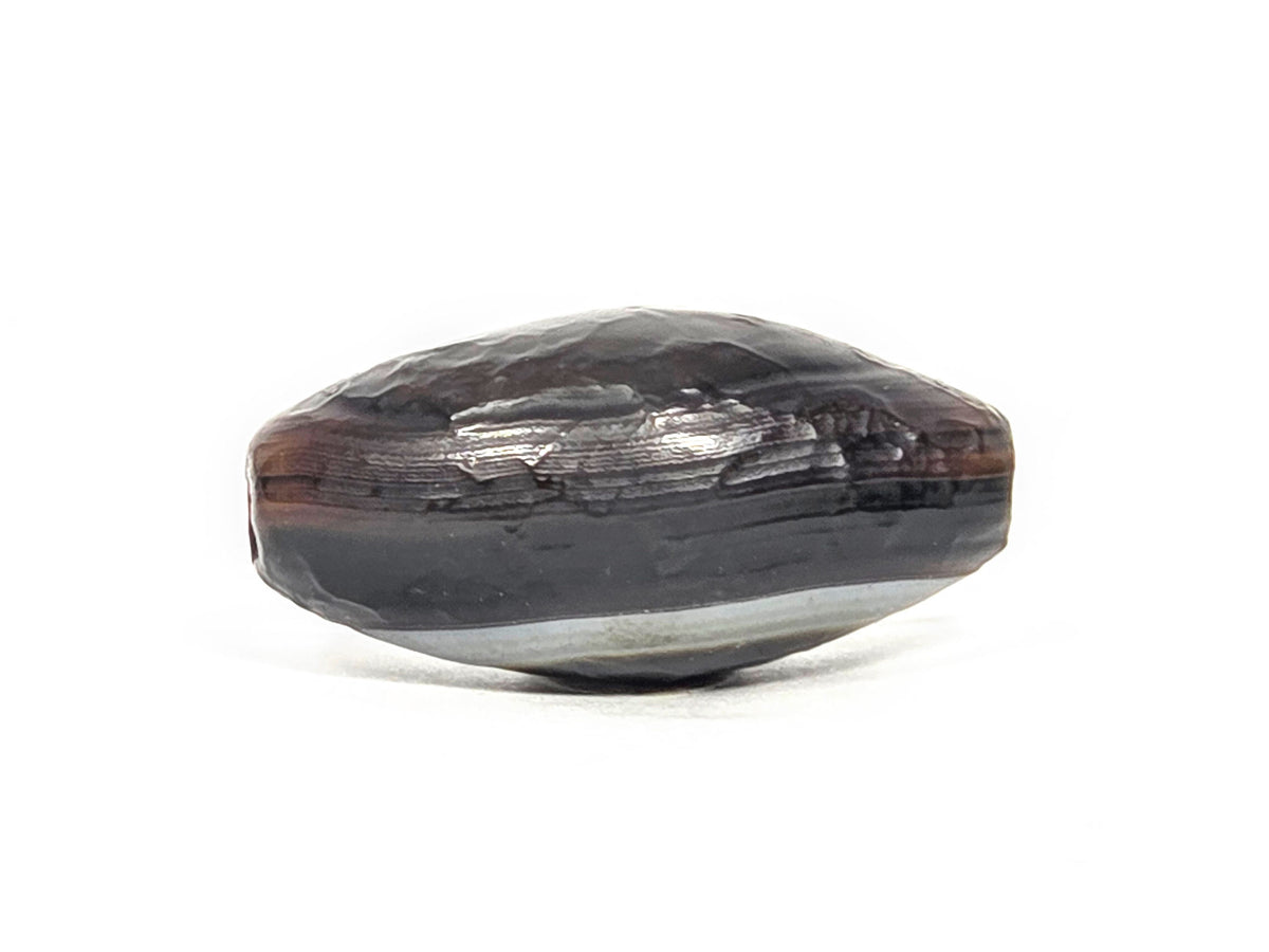 N-N-071026-1E-OLV natural one eye dzi dark brown agate face D banding visible raw edge texture unretouched